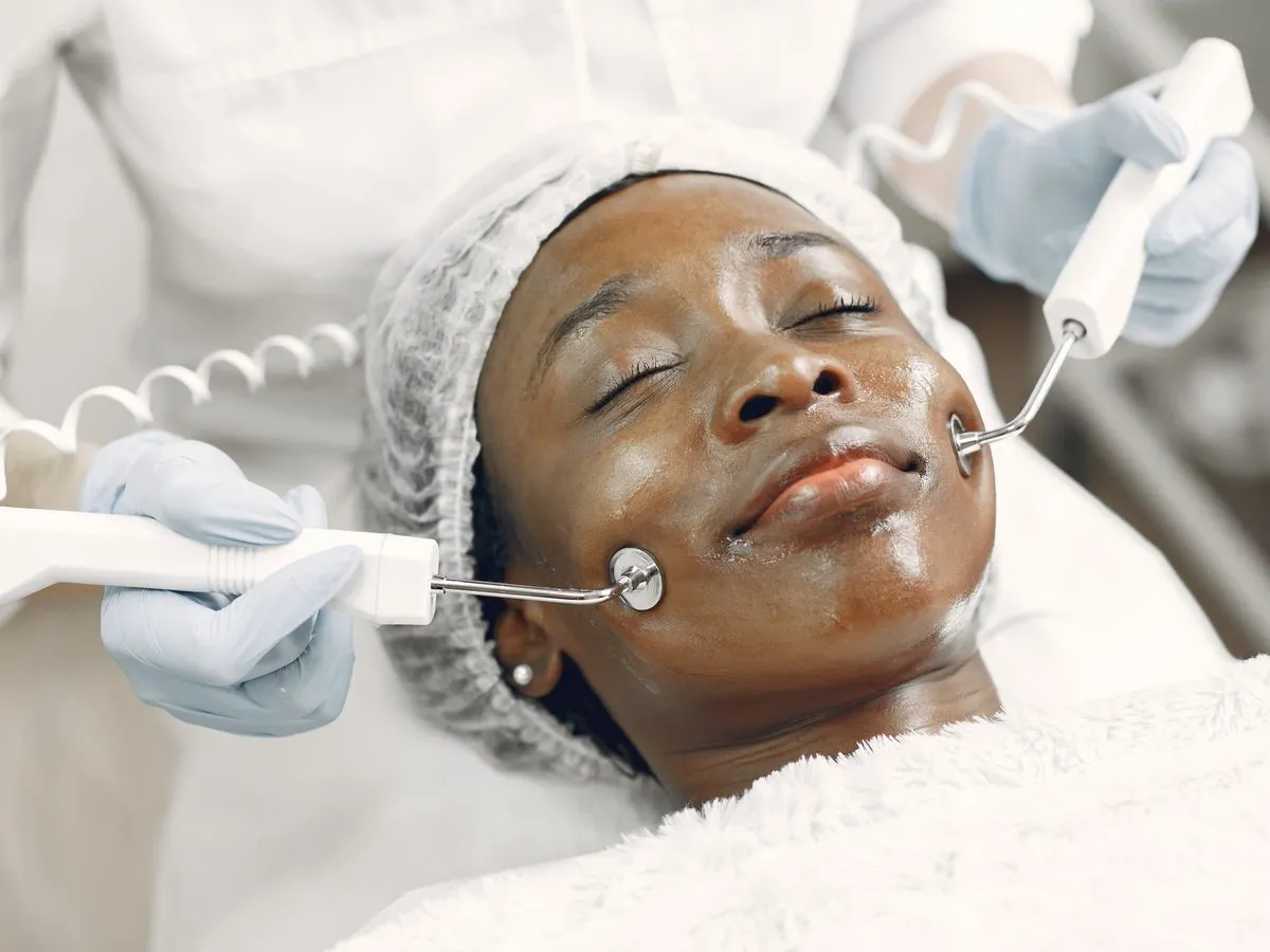 Professional device-led facial treatment in a calm studio setting